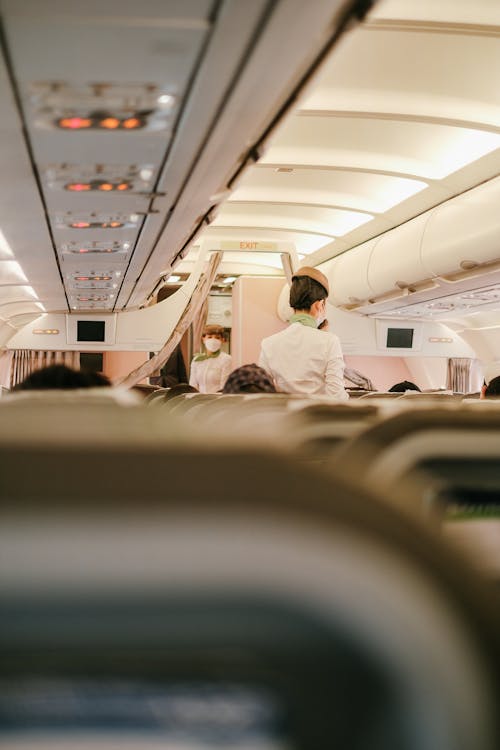 Free Flight Attendants on Aircraft Board Stock Photo