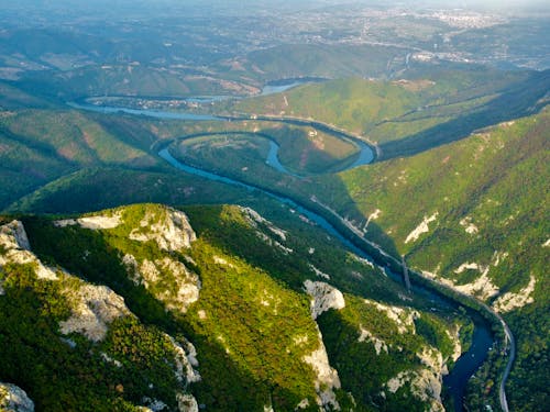 Aerial View of a River Running Through the Mountains