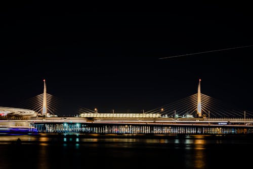 Illuminated at Night Suspension Bridge in City