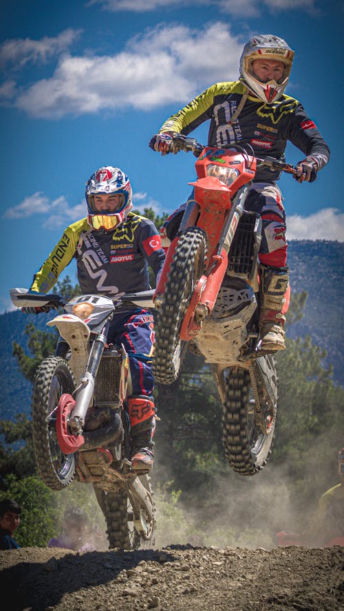 Two Men Riding a Motocross