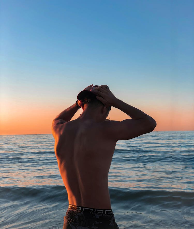 Back View Of A Man In The Sea 