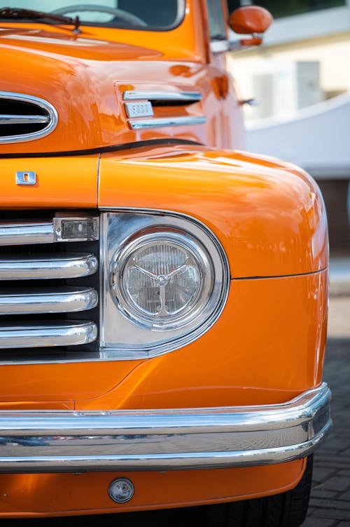 Headlight of an Orange Car
