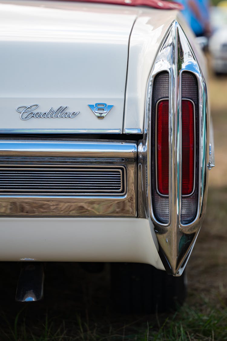 A Close-Up Shot Of The Tail Light Of A Vintage Cadillac Coupe De Ville