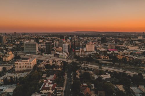 Free A breathtaking aerial view of Los Angeles, California, captured at sunset showcasing the vibrant urban landscape. Stock Photo