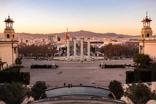 Free Beautiful sunset view of Barcelona cityscape from Montjuïc with historical architecture and vibrant city vibes. Stock Photo