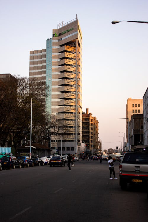 High Rise Building with Glass Panels Along a Street