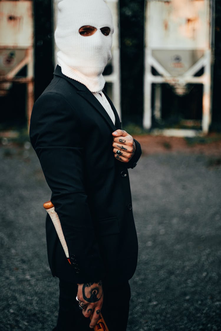 Man Wearing A Ski Mask And Suit