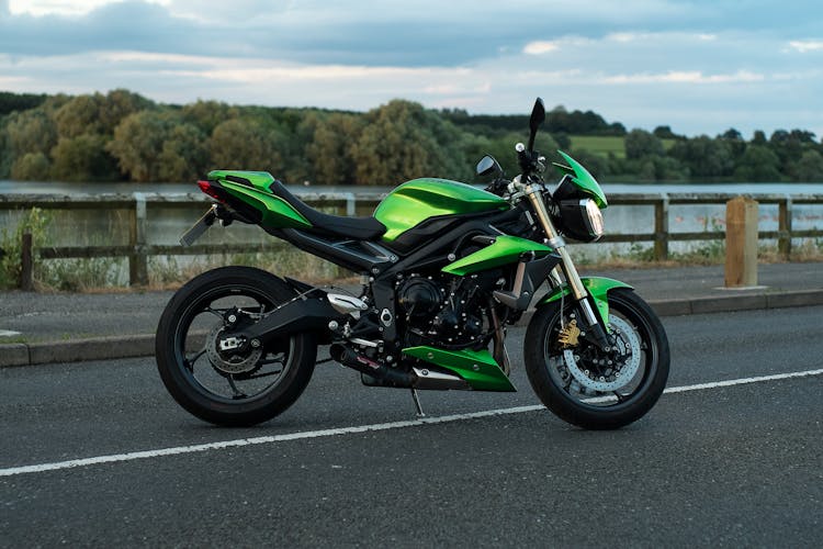 A Triumph Speed Triple Motorcycle On A Road