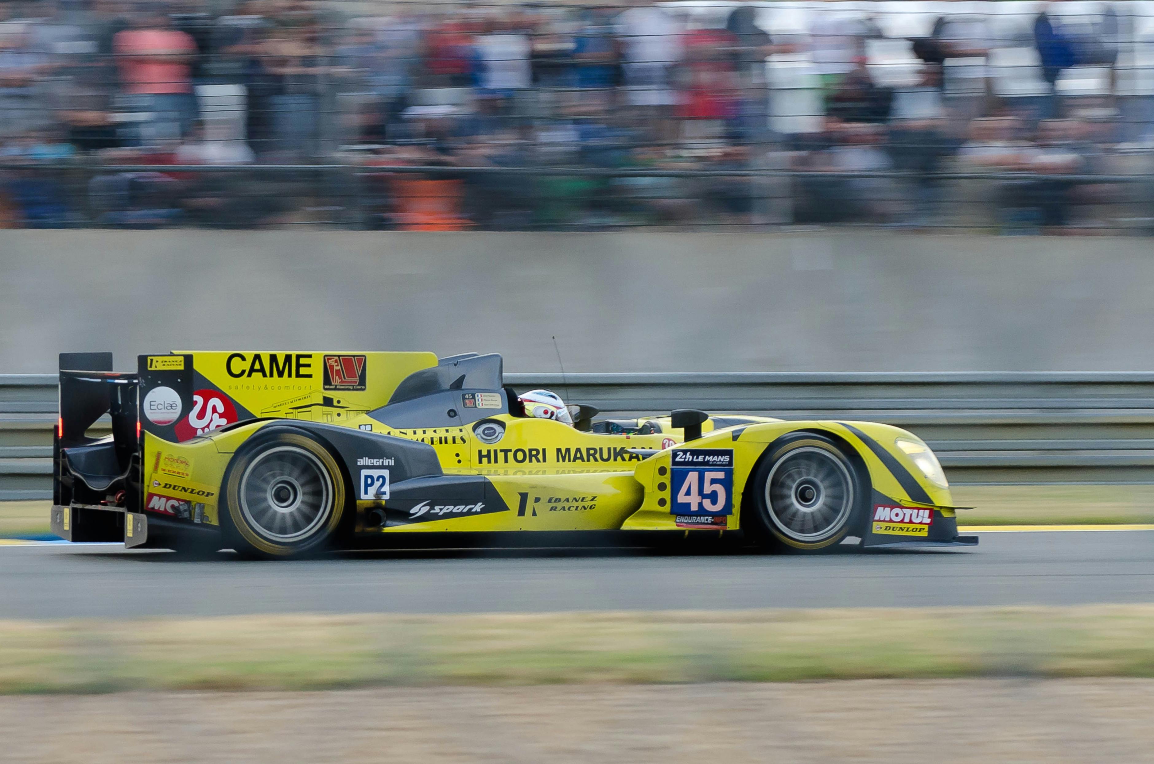 yellow race car on track