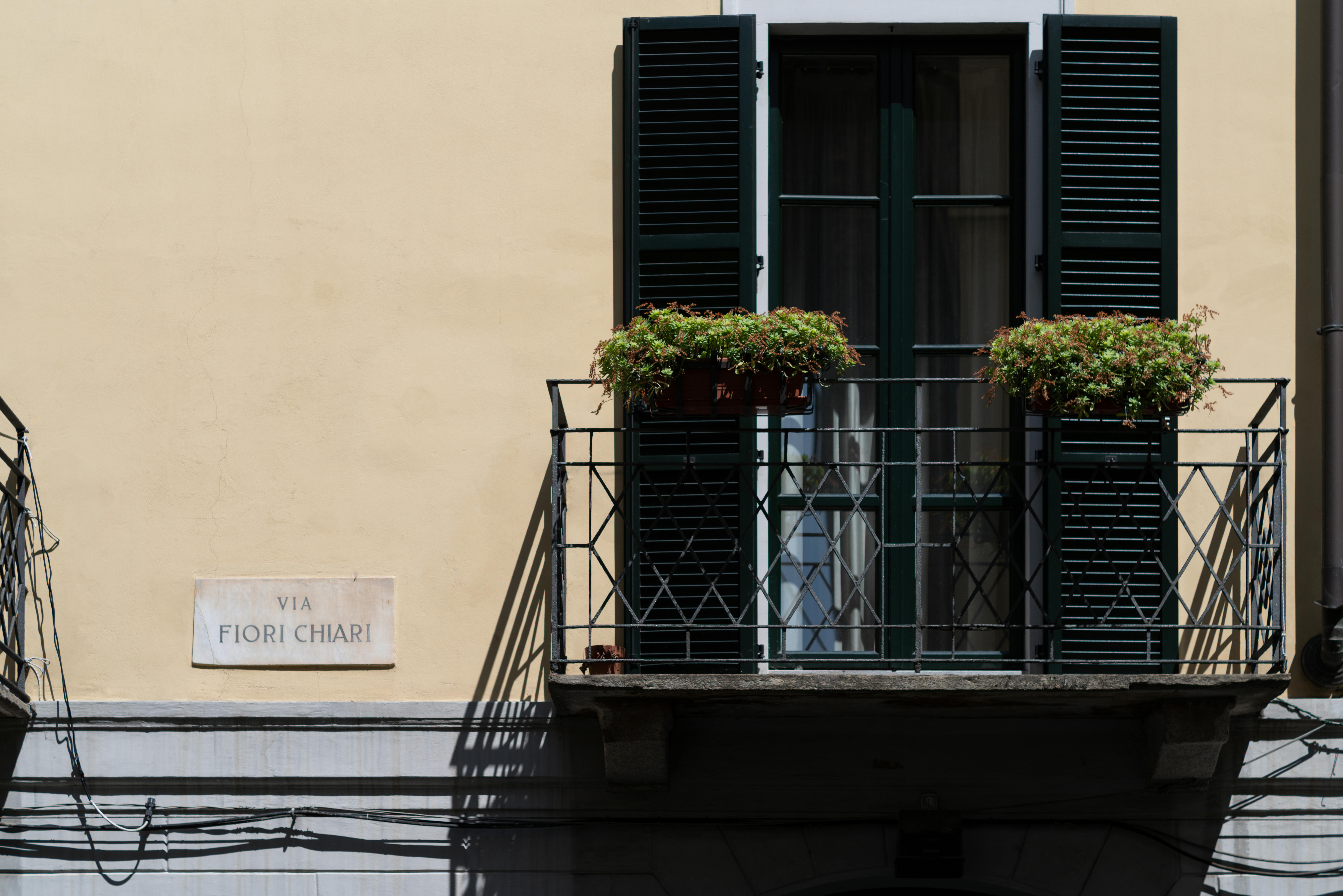 Red Textile Hanging on Metal Railing · Free Stock Photo