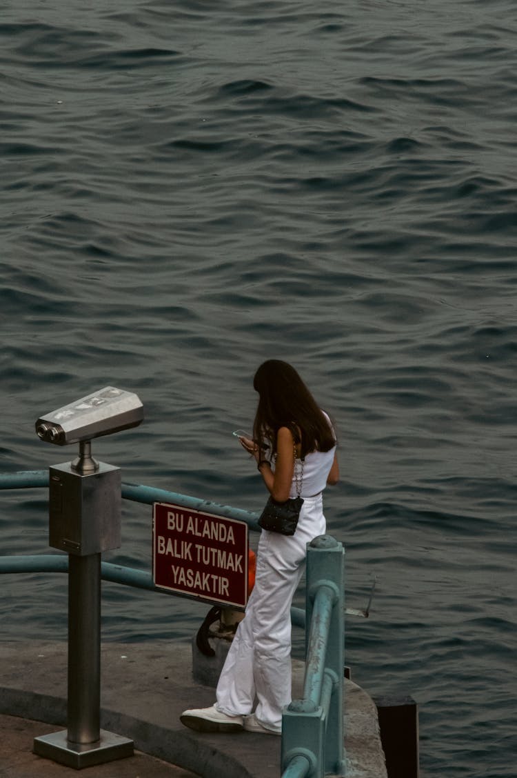 Woman Standing Alone On A Viewing Deck 