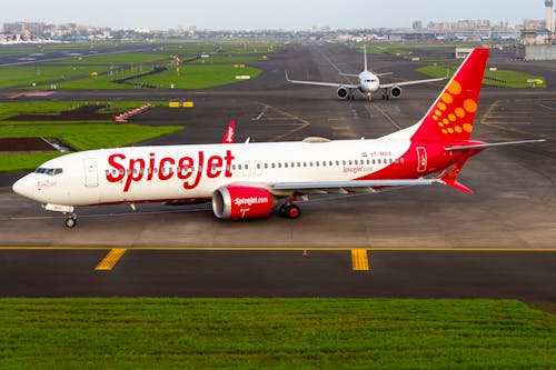 Parked Airplane in an Airport Runway 