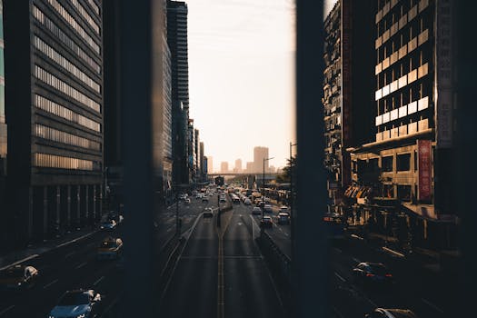 Street photography of a bustling urban cityscape with high-rises during sunset.