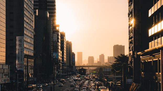 Dynamic cityscape shot during sunset showcasing busy streets and towering skyscrapers.