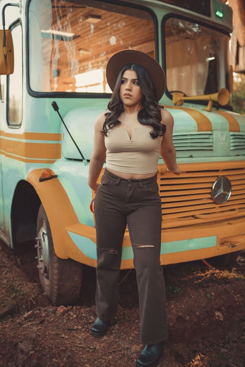 A Woman Standing in Front of a Bus