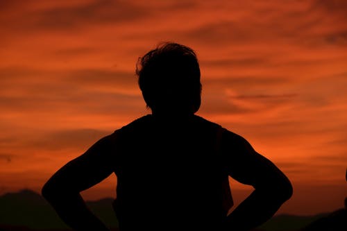 A Silhouette of a Person during the Golden Hour