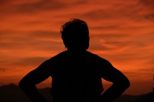 A Silhouette of a Person during the Golden Hour