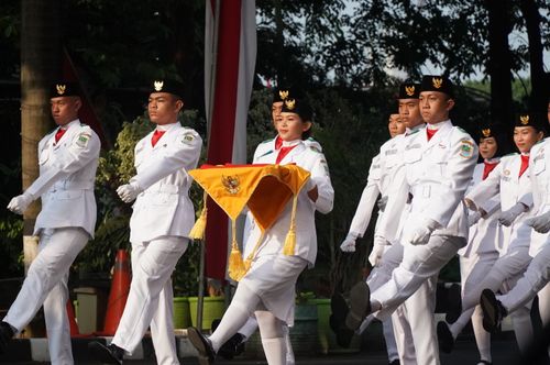 Free Indonesian soldiers in uniform marching in a ceremonial parade outdoors. Stock Photo