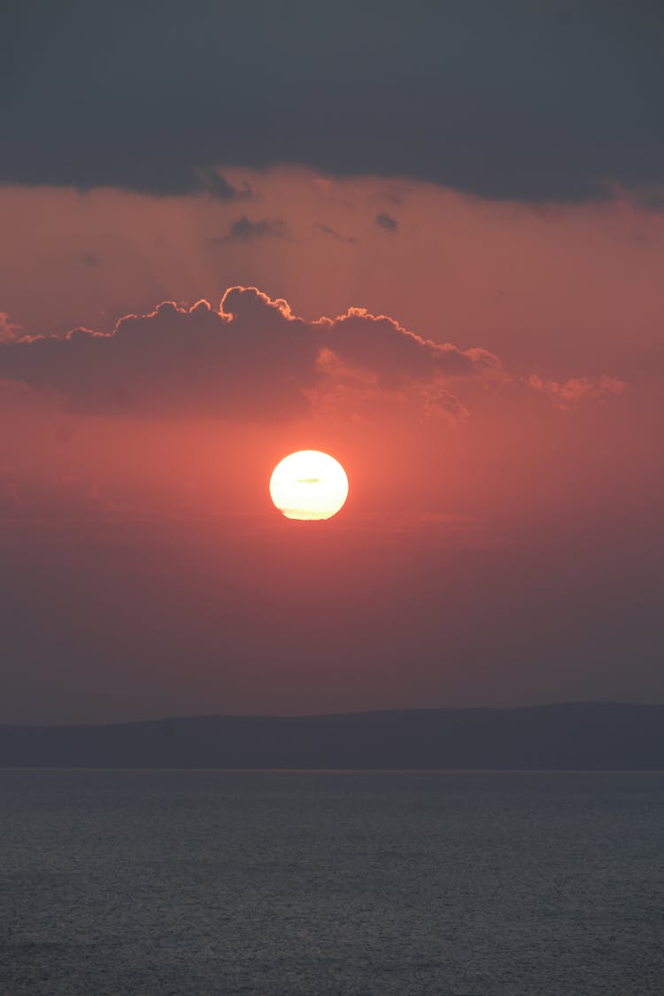 Scenic View Of Calm Sea During Sunset 