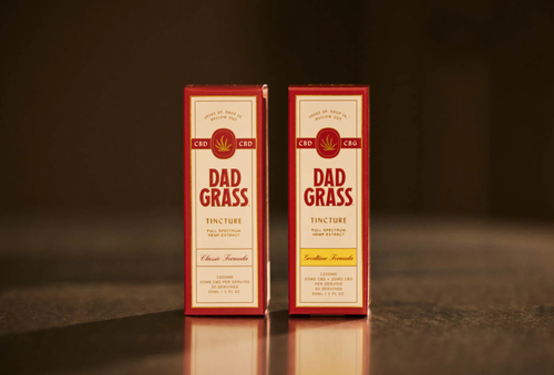 Free Close-up of Dad Grass CBD and CBG hemp tincture product packaging. Stock Photo