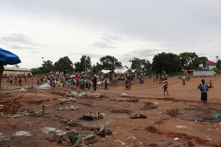 Indigenous People On A Dirt Ground 