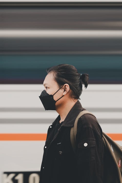 Free Woman in Black Leather Jacket Wearing Black Headphones Stock Photo