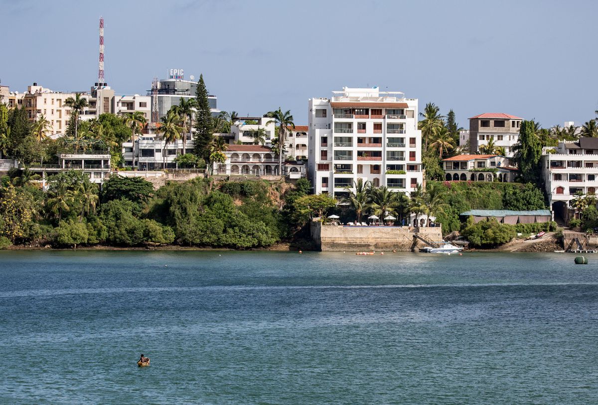 Mombasa waterfront buildings and palms beside the ocean
