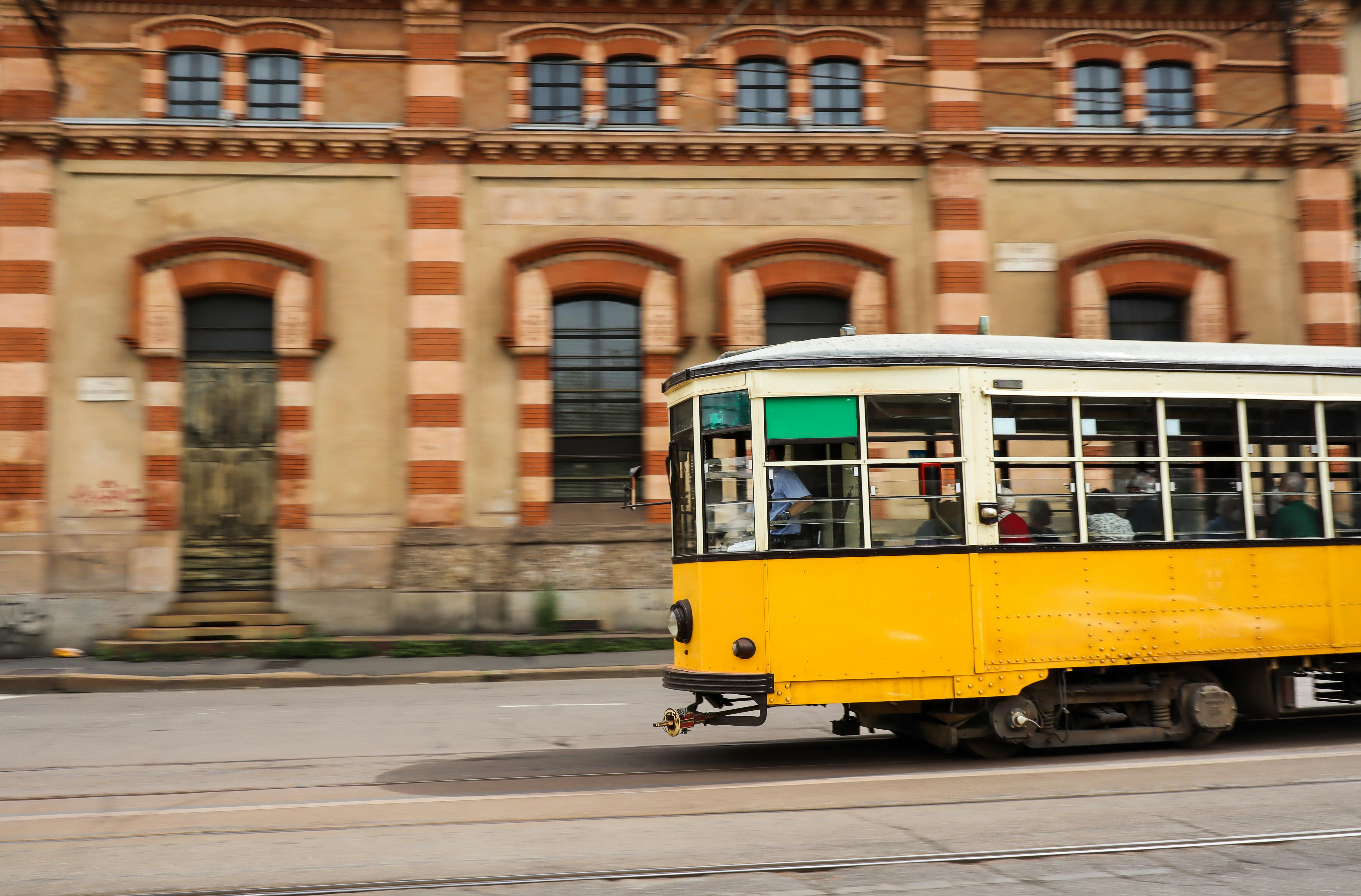 side view of a yellow tram