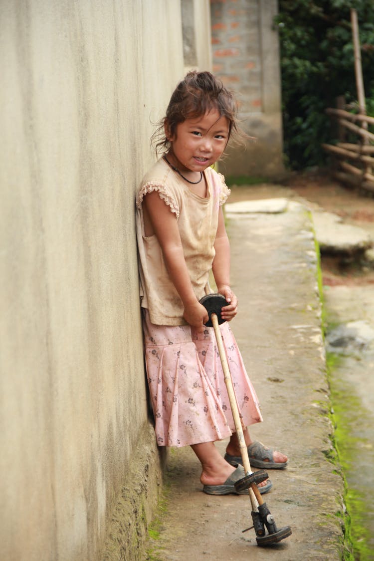 Cute Girl Leaning On A Wall 