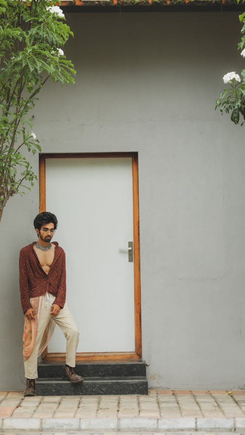 A Man Standing in Front of a Door