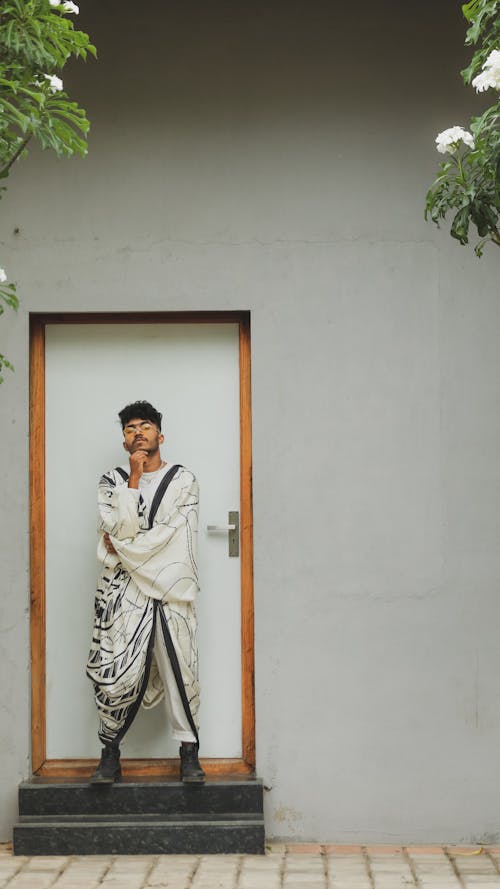 Man Wearing White Kimono in Front of a Door 