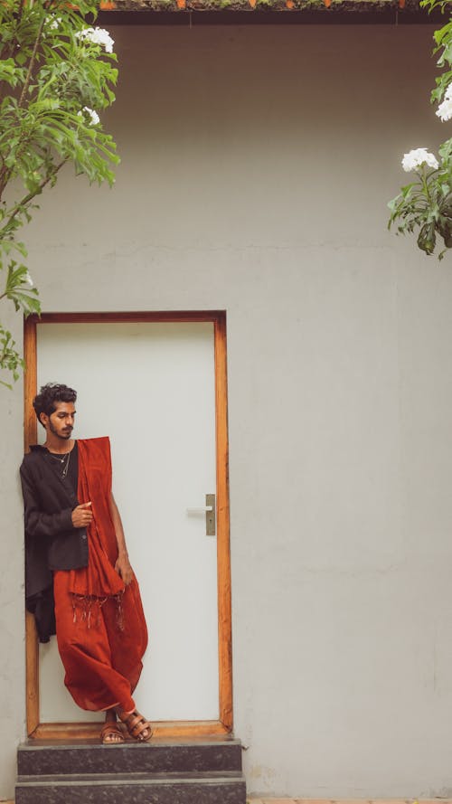 A Man Standing in Front of a Door