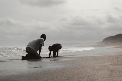 Father and Child Playing in the Beach