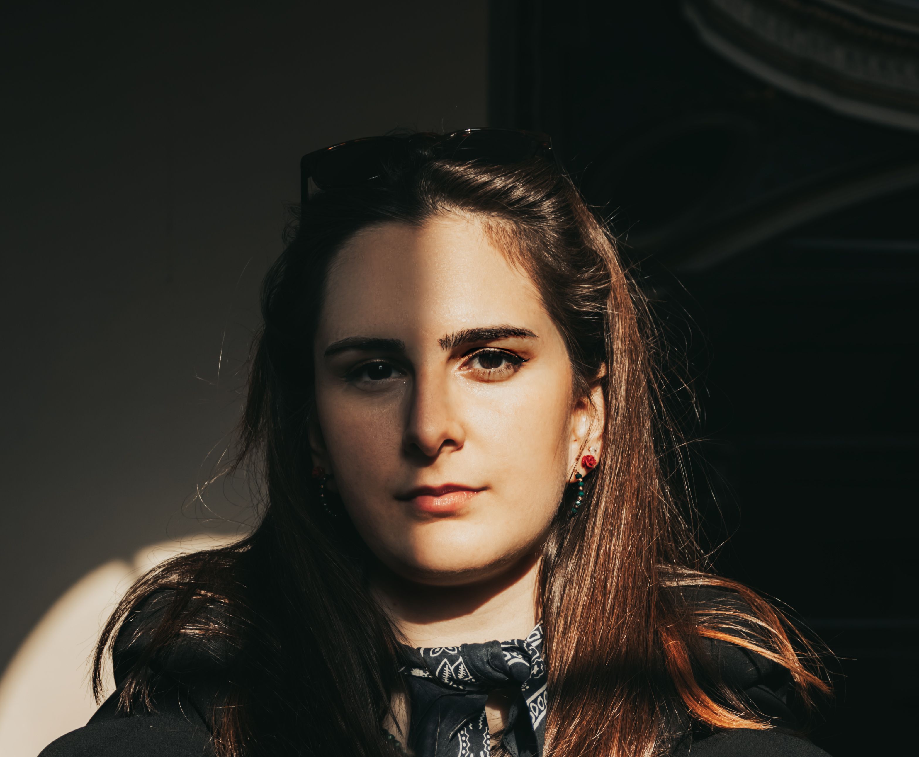 Stylish portrait of a woman in İzmir, capturing natural light and shadows.