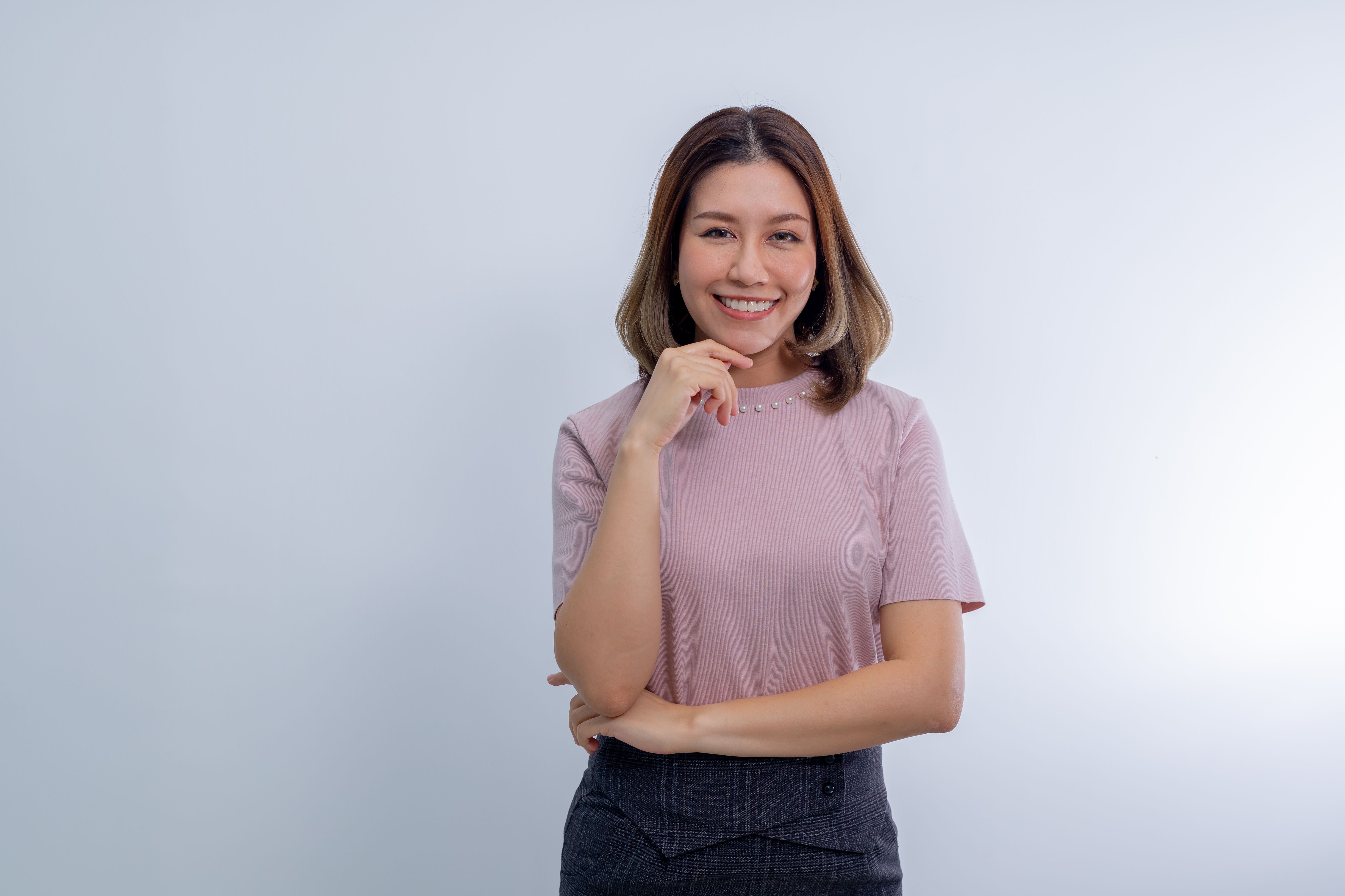 Smiling Woman Posing with Hand on Chin · Free Stock Photo