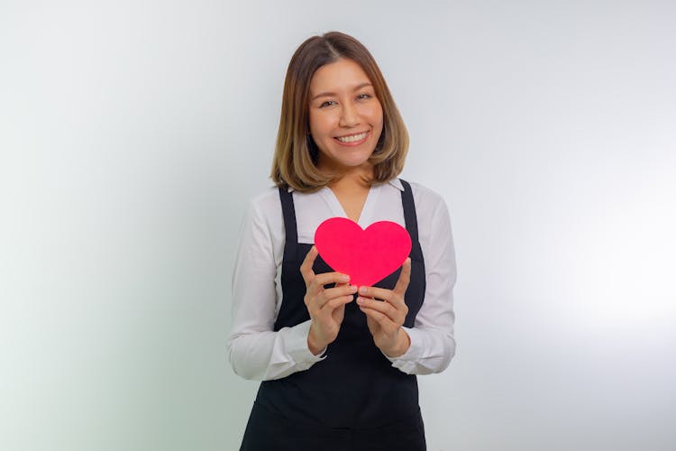 Smiling Woman Posing With Heart