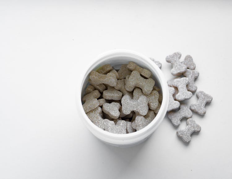 Close-up Of Dog Treats On A Container