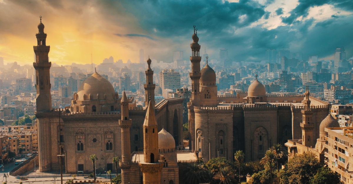 Minarets rising above the rooftops of Islamic Cairo at dusk