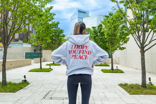 Blackview of Woman wearing Gray Hoodie 