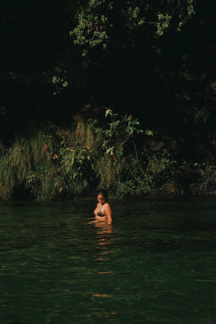 Woman Swimming At A River