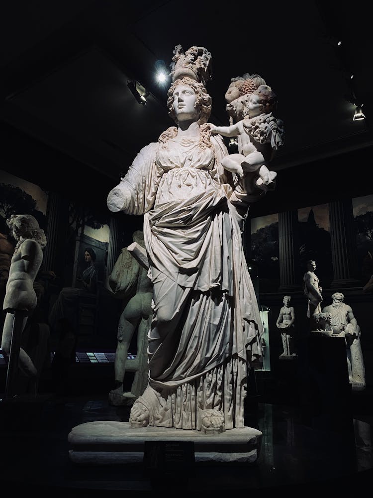 A Sculpture Of Tyche In A Museum