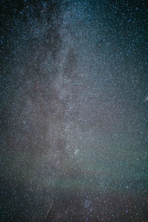 Free A vertical shot capturing a starry night sky with visible constellations and stars. Stock Photo