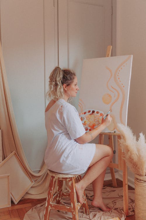 A Woman Painting on a Canvas 