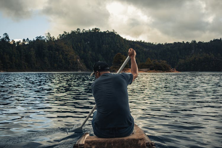 Man Paddling On Lake