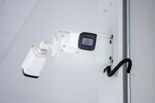 Mounted Surveillance Camera on the Wall 