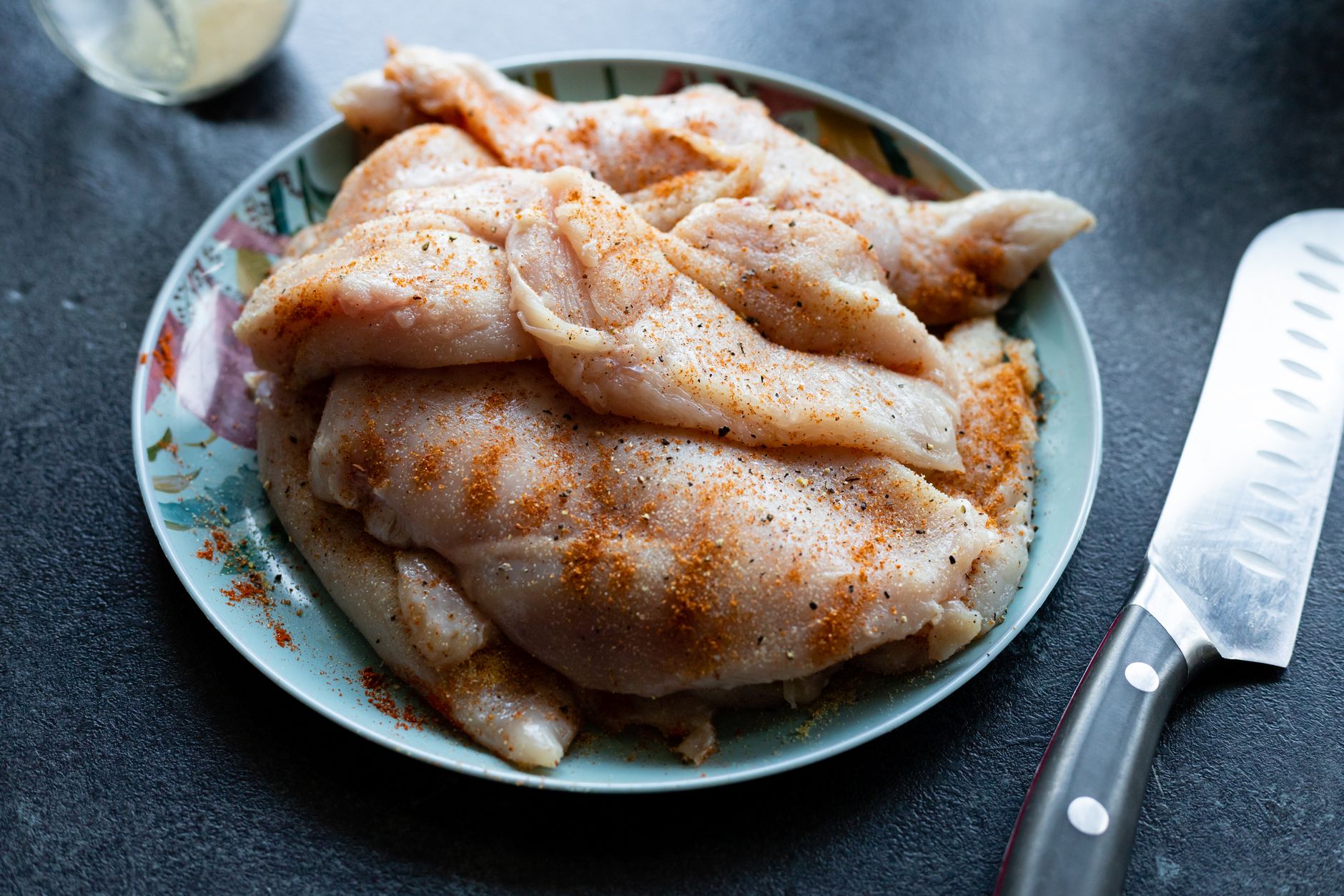 Close-up of golden braised paprika chicken with crispy skin