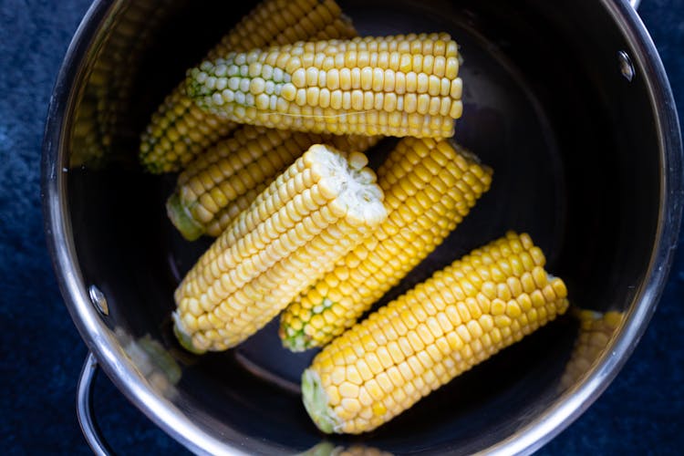 Raw Corn On A Pot 