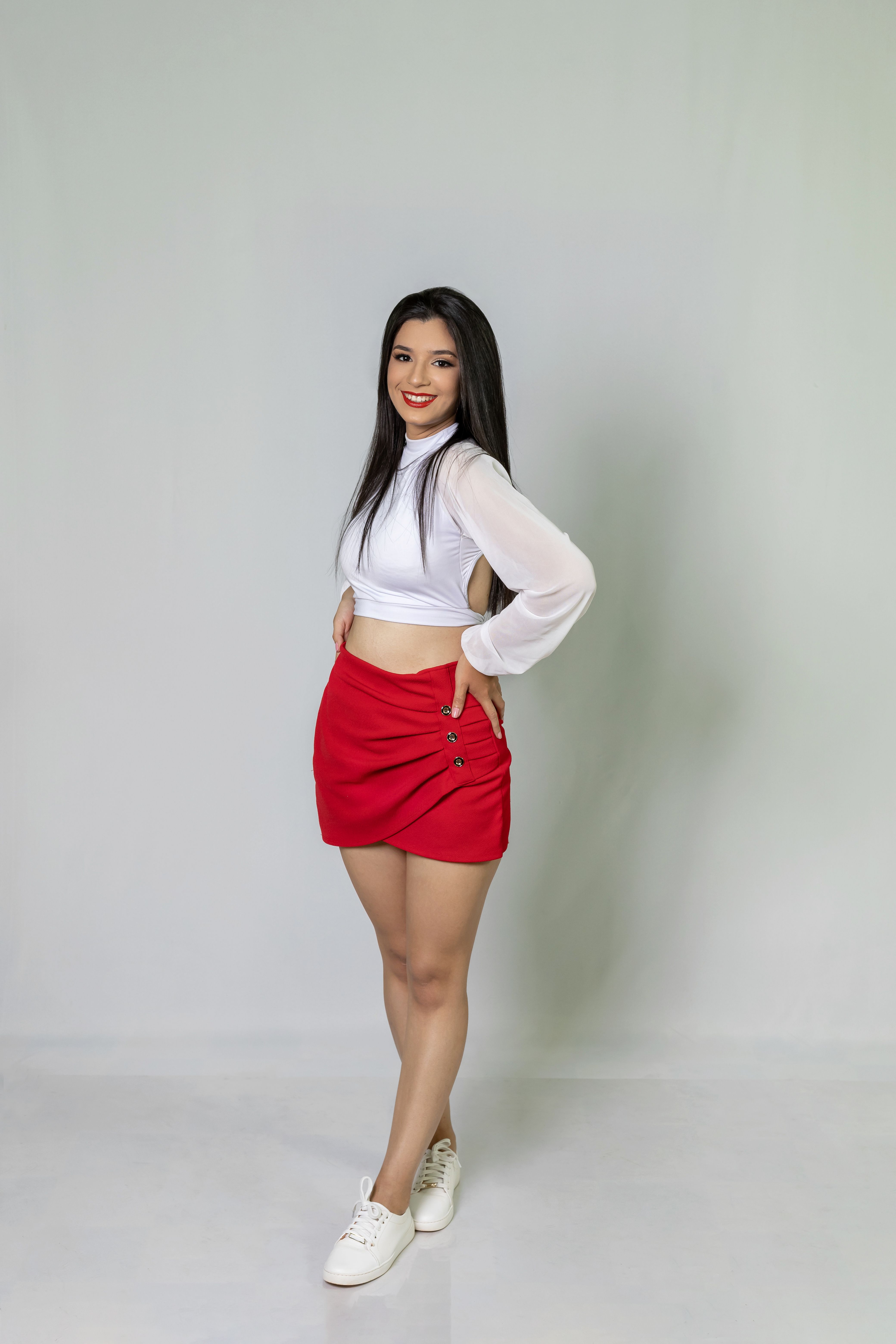 Woman Wearing White Top and Red Skirt · Free Stock Photo
