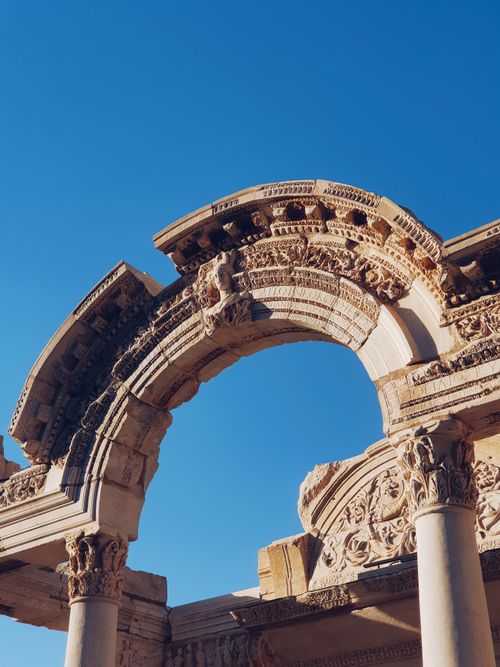 Free Explore the detailed stone arch of Hadrian's Temple in Ephesus, Turkey, a historical architectural marvel. Stock Photo