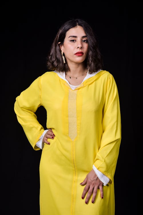 Woman with Red Lipstick Wearing a Yellow Moroccan Dress